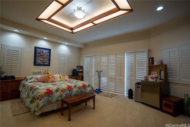 bedroom with light colored carpet and crown molding