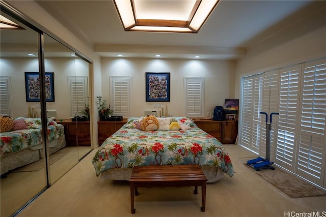 bedroom featuring light colored carpet and ornamental molding