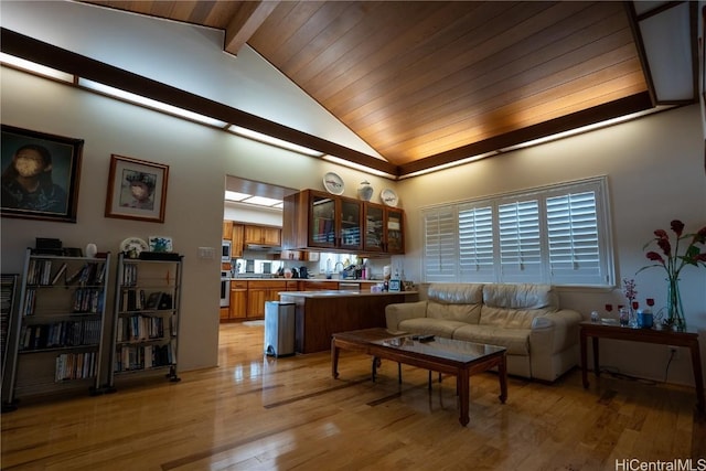 living room featuring beam ceiling, high vaulted ceiling, light hardwood / wood-style flooring, and wood ceiling