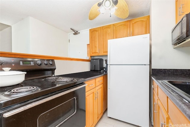 kitchen featuring black appliances, ceiling fan, light tile patterned flooring, and a textured ceiling