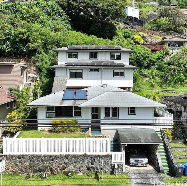 rear view of house with a carport