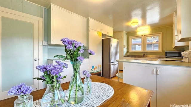 kitchen with white cabinets, sink, and appliances with stainless steel finishes