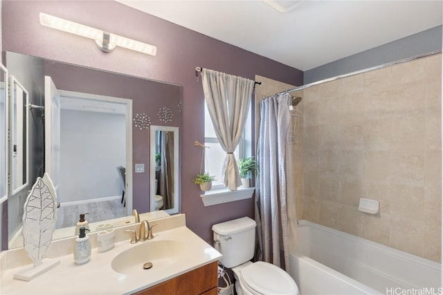 full bathroom featuring vanity, toilet, and shower / bathtub combination with curtain