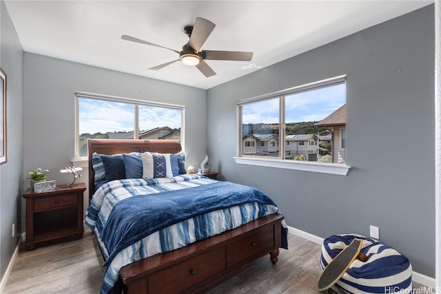 bedroom featuring ceiling fan and wood-type flooring