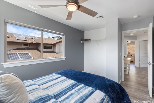 bedroom featuring ceiling fan and wood-type flooring