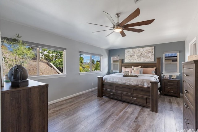 bedroom featuring ceiling fan and dark hardwood / wood-style floors