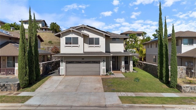 view of front of home with a front lawn and a garage