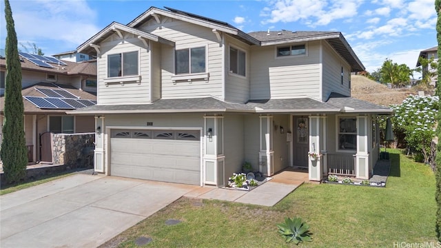 view of front of home with a front lawn and a garage