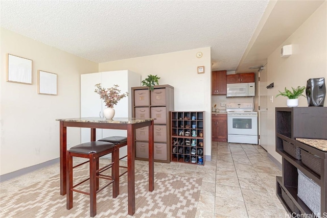 dining area with a textured ceiling