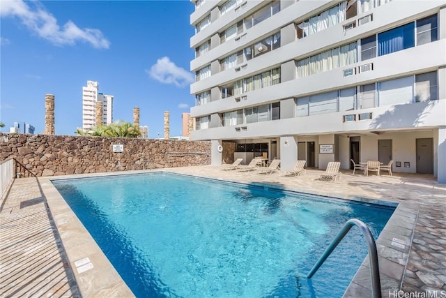 view of pool featuring a patio area