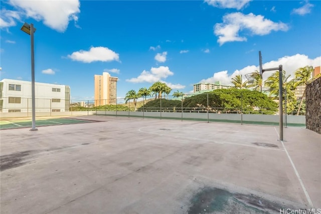 view of basketball court with tennis court