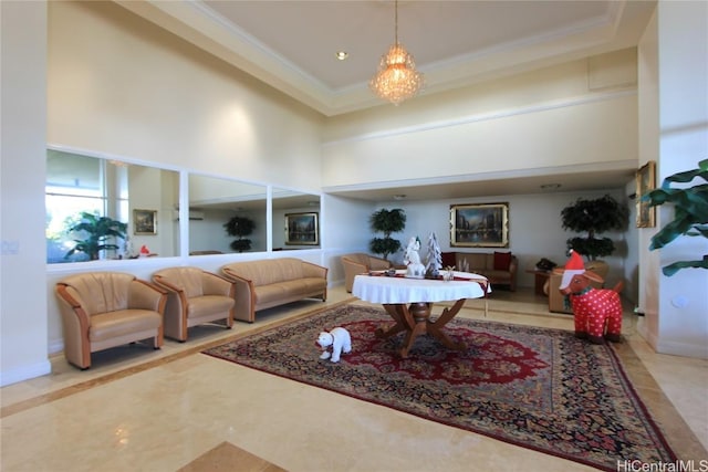 living room with a chandelier, a high ceiling, and crown molding