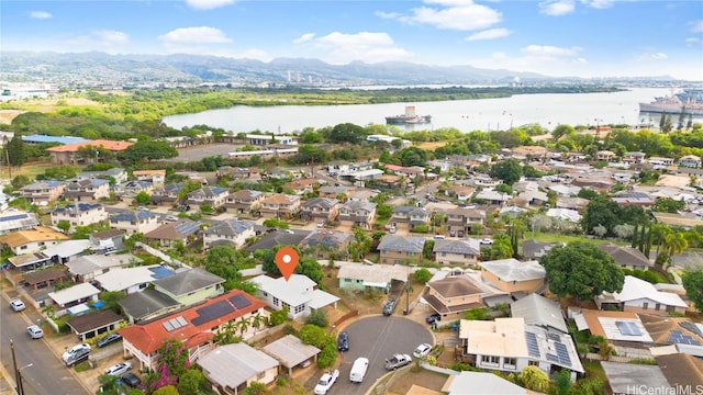 birds eye view of property featuring a water and mountain view