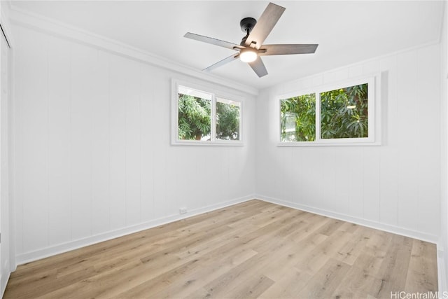 empty room with ceiling fan and light wood-type flooring