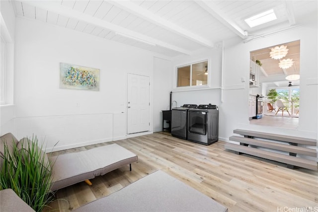 mudroom featuring washing machine and dryer, wood ceiling, a notable chandelier, beamed ceiling, and light hardwood / wood-style floors