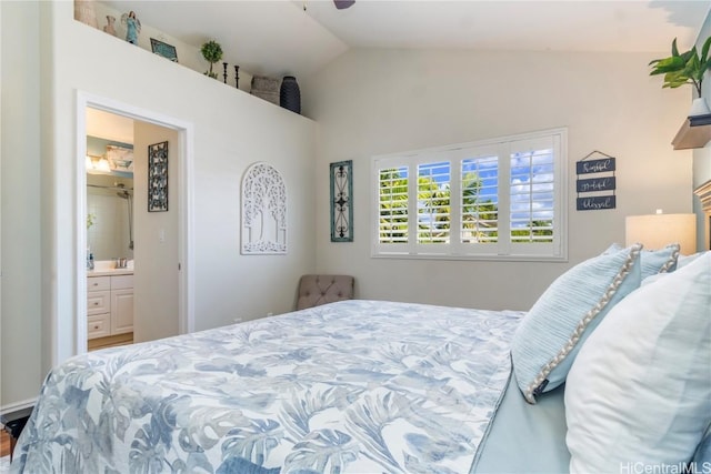 bedroom with vaulted ceiling and ensuite bathroom