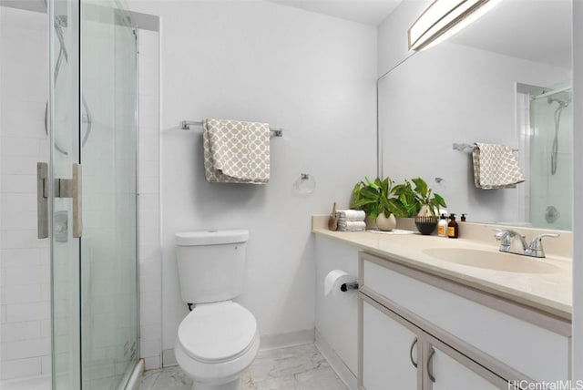 bathroom featuring vanity, toilet, and walk in shower