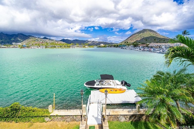 view of dock featuring a water and mountain view