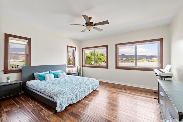 bedroom featuring hardwood / wood-style floors and ceiling fan