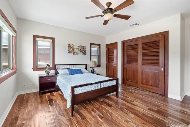 bedroom featuring ceiling fan and dark hardwood / wood-style flooring