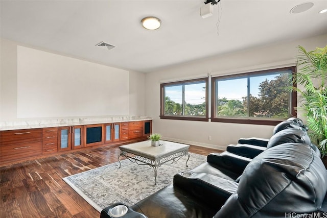 living room with dark hardwood / wood-style flooring