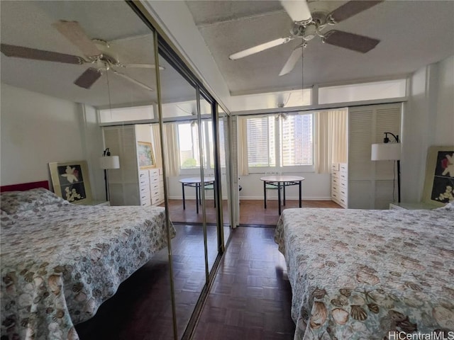 bedroom with a ceiling fan and baseboards