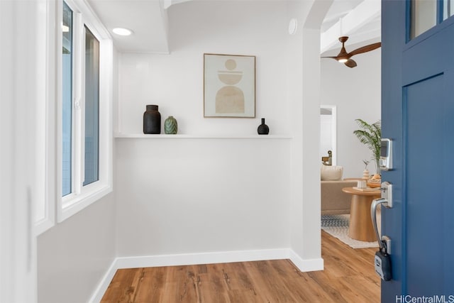 entrance foyer featuring ceiling fan, beam ceiling, and light wood-type flooring