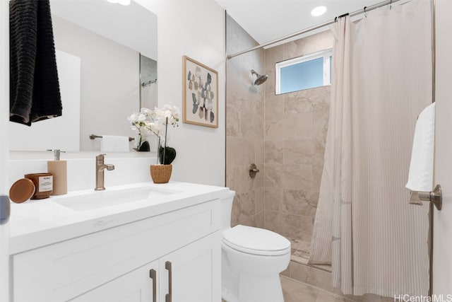 bathroom with vanity, toilet, and walk in shower