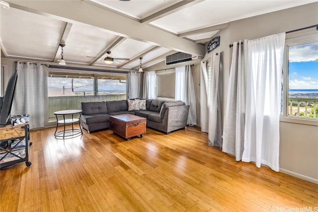 living room with lofted ceiling with beams, ceiling fan, and wood-type flooring