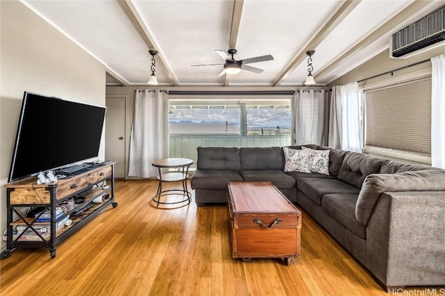 living room featuring a wall mounted air conditioner, light wood-type flooring, and ceiling fan