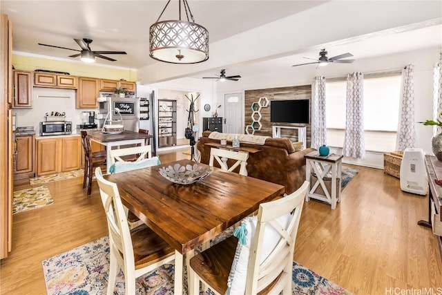 dining area featuring light wood-type flooring