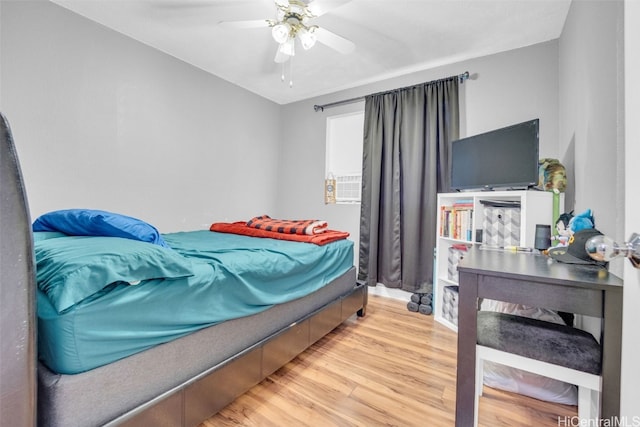 bedroom featuring ceiling fan and hardwood / wood-style floors