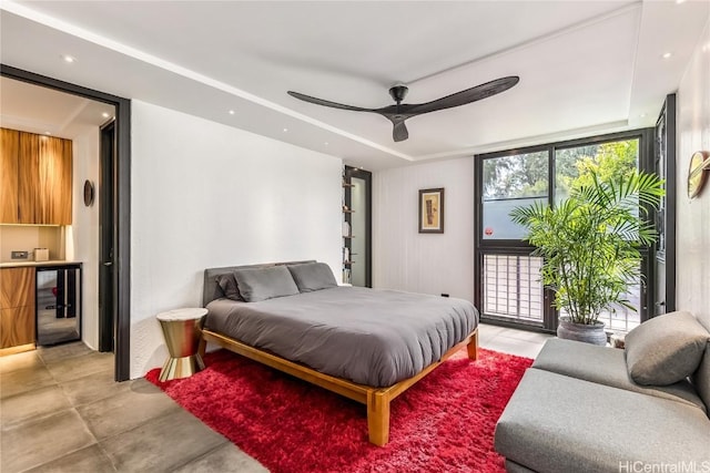 bedroom featuring wine cooler, ceiling fan, and access to exterior