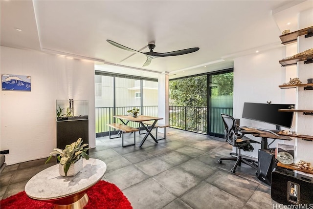 office featuring floor to ceiling windows and ceiling fan