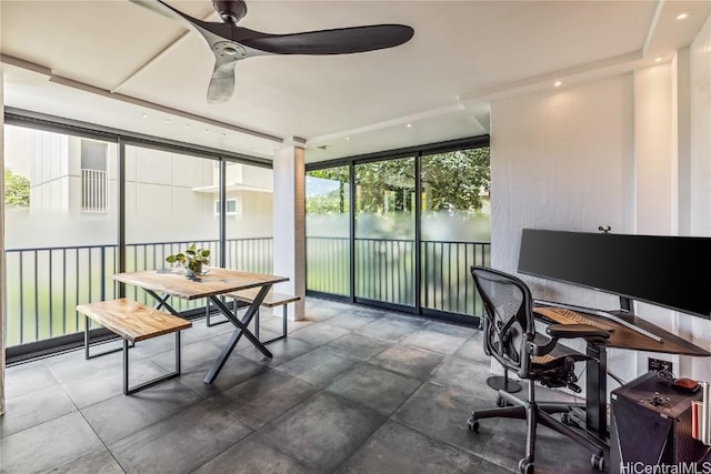 office area featuring a wall of windows and ceiling fan