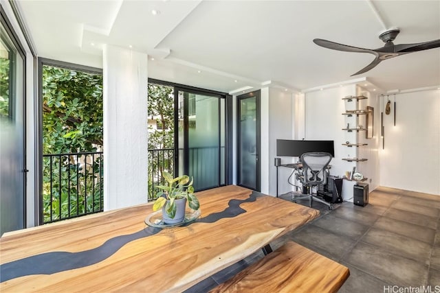 dining room with expansive windows and ceiling fan