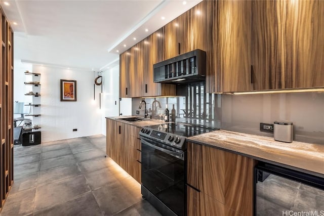 kitchen featuring wood counters, sink, and range with electric stovetop