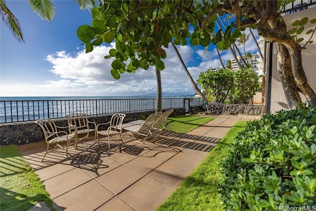 view of patio / terrace with a water view