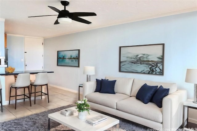 living room featuring ceiling fan and light tile patterned floors