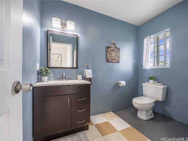 bathroom with vanity and toilet