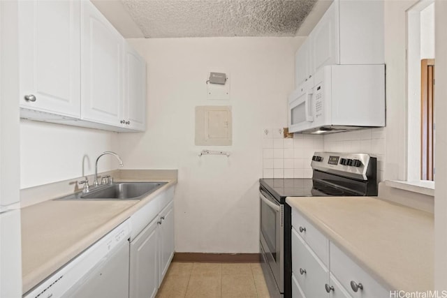 kitchen featuring sink, tasteful backsplash, a textured ceiling, white appliances, and white cabinets