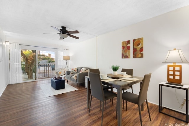 dining area featuring ceiling fan and dark hardwood / wood-style flooring