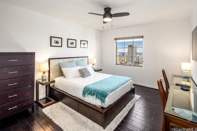 bedroom featuring dark wood-type flooring and ceiling fan