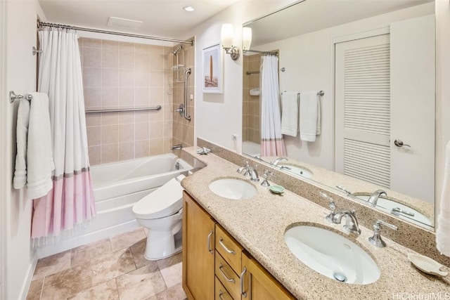 full bathroom featuring vanity, toilet, and shower / bath combo