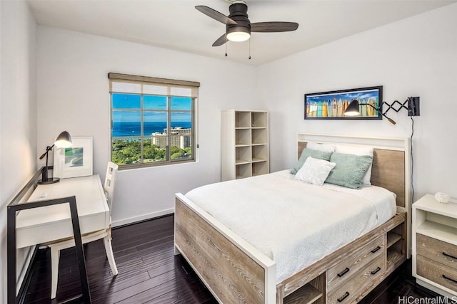 bedroom featuring dark hardwood / wood-style floors and ceiling fan