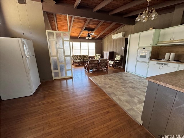 kitchen featuring ceiling fan with notable chandelier, white appliances, wood ceiling, decorative light fixtures, and a wall mounted AC