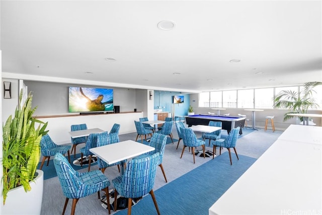 carpeted dining room with billiards