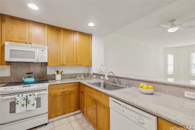 kitchen featuring sink, light tile patterned floors, ceiling fan, light stone counters, and white appliances