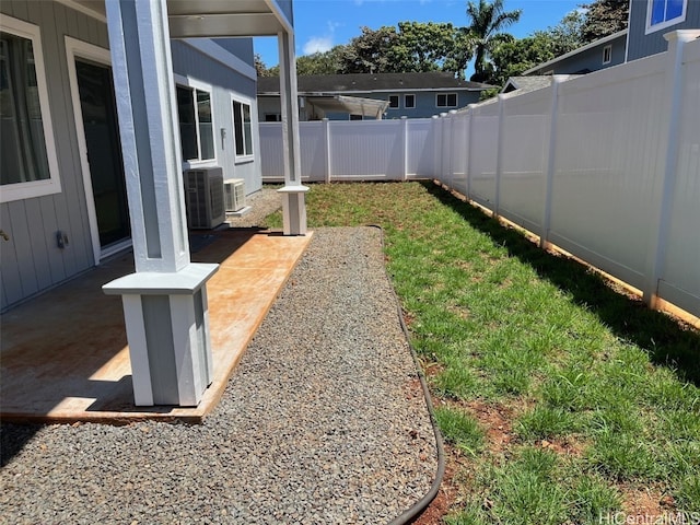 view of yard with a patio and central AC