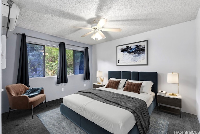 carpeted bedroom featuring ceiling fan and a textured ceiling